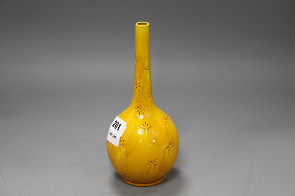 A Burmantofts yellow glazed vase, with impressed stylised floral decoration, monogrammed and numbered 358, height 23cm